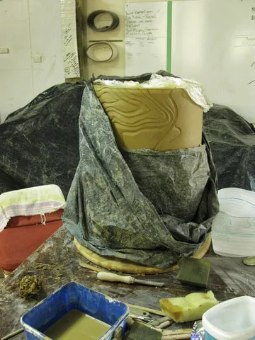 A carved segment under wraps in the studio