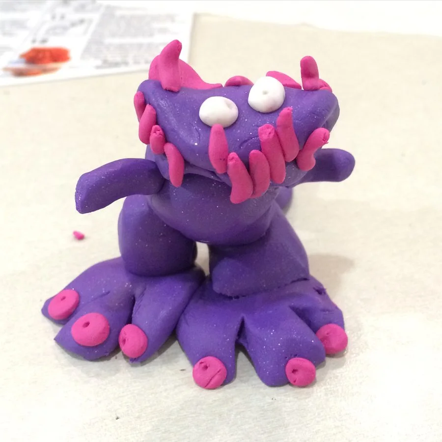 A purple clay monster with pink spikes