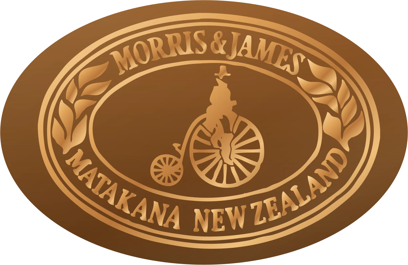 A small bronze Morris & James emblem with a magnet for the fridge