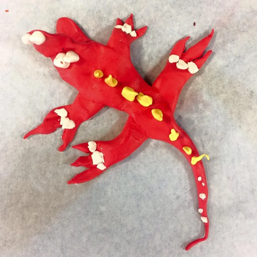 A clay alligator made in a Klay Master workshop