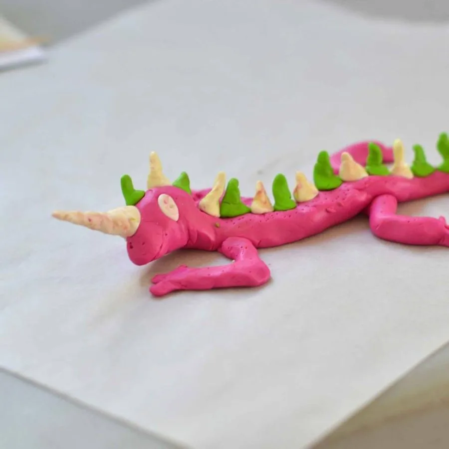 A clay tuatara made in a Klay Master workshop