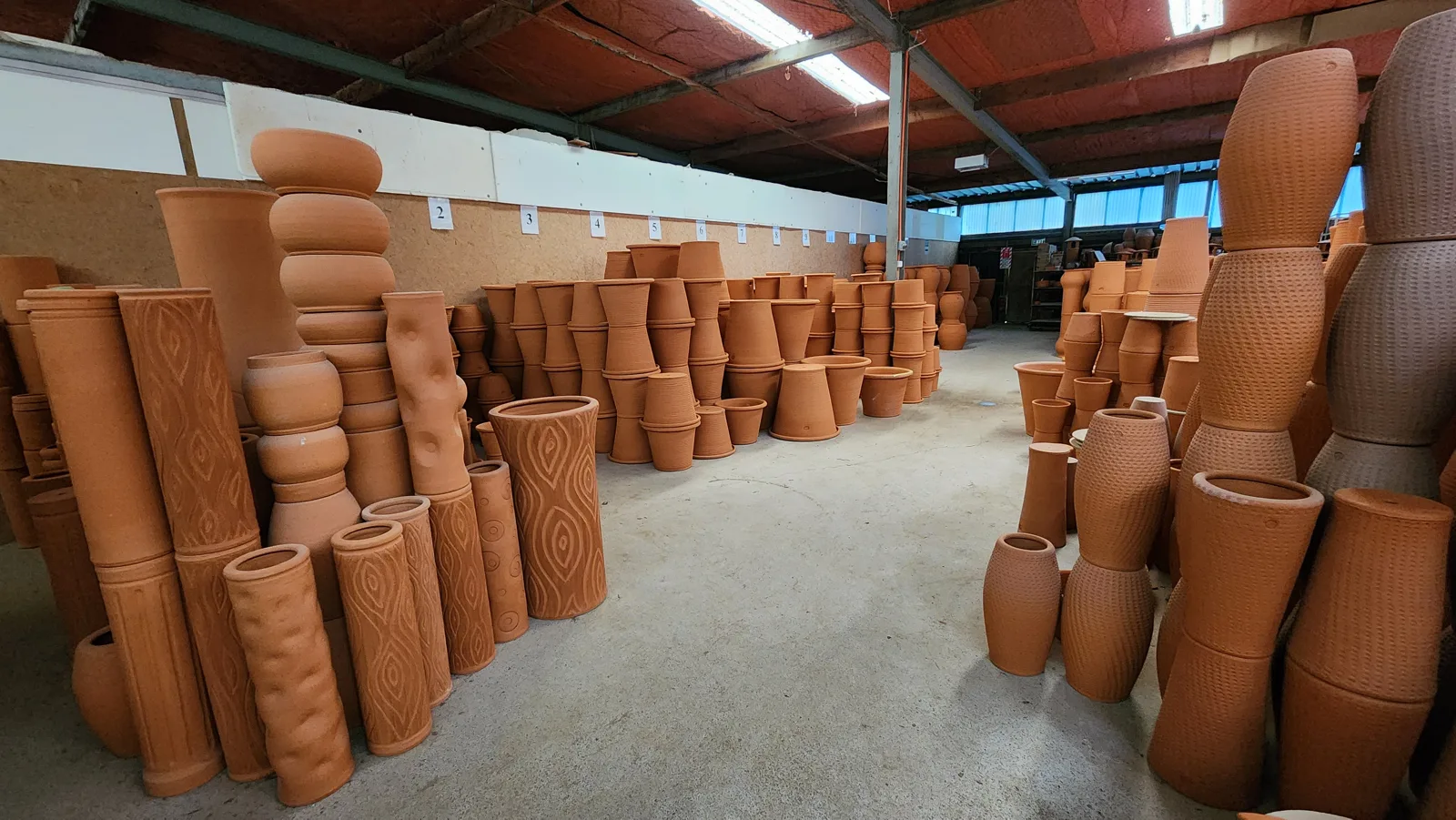 Fired but unglazed terracotta pots in the Matakana factory