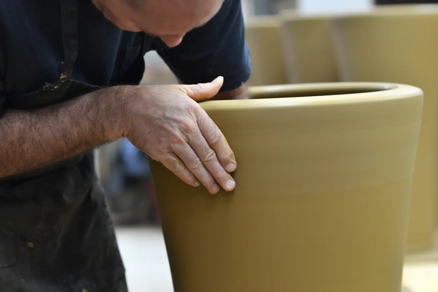 Ian Foote, Head Potter, throwing an Umbrella pot