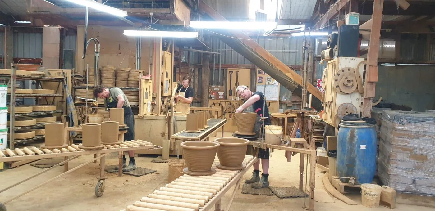 Morris & James staff together at the pottery