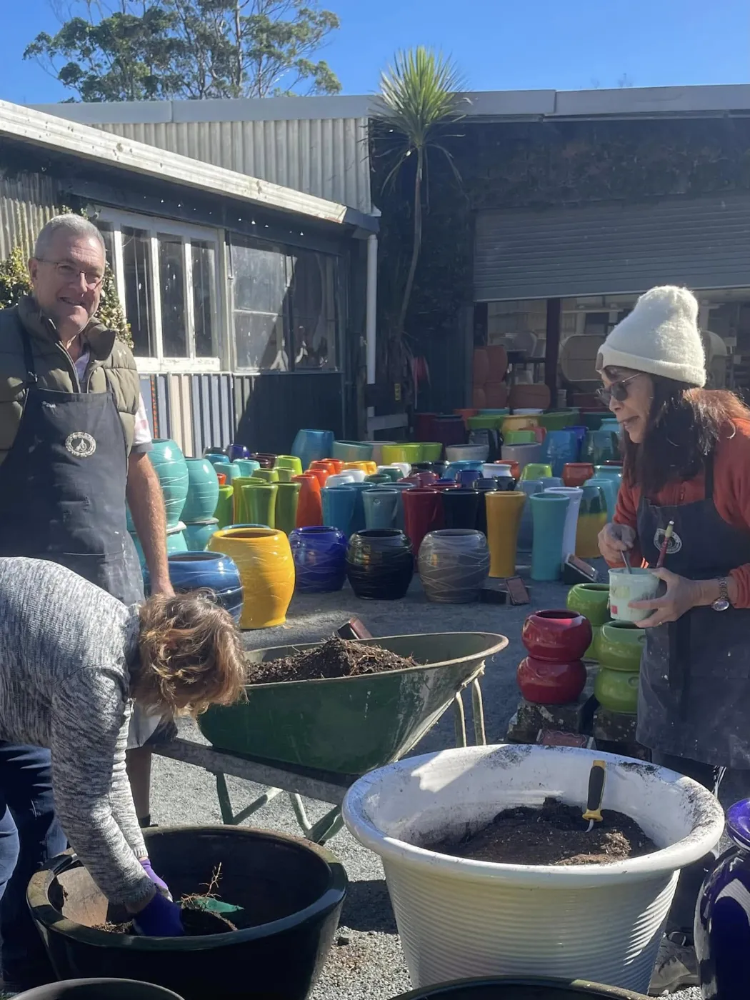 Morris & James staff together at the pottery