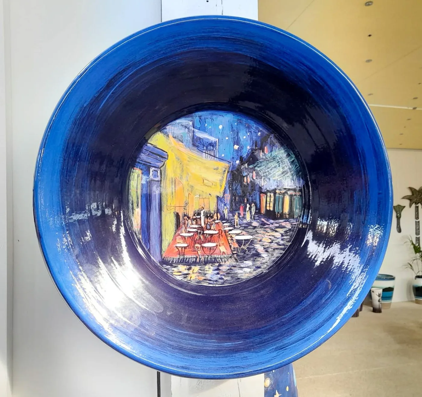 A deep blue Grand Platter hand-painted with a caf&eacute; terrace at night