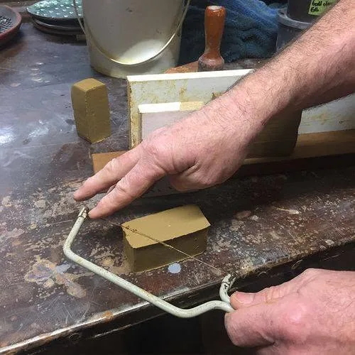Cutting the clay with a wire