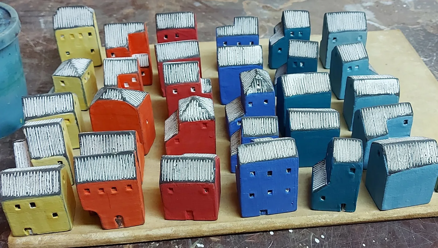 Painted houses in yellow, orange, red and blue