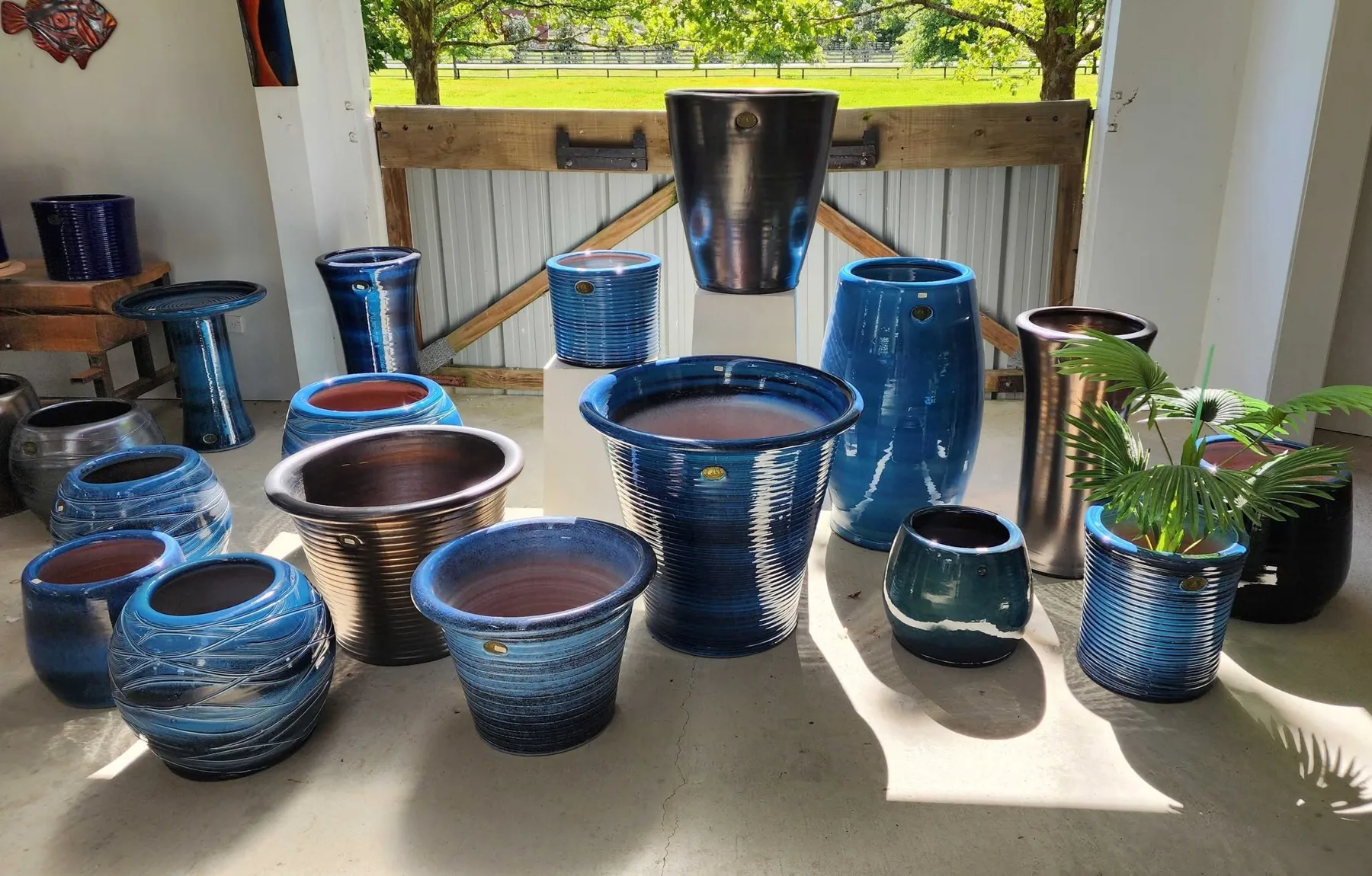 Pots in the blue Oceans glaze on display at the showroom