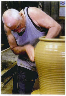 Throwing a pot at Morris and James Pottery, Matakana, New Zealand.